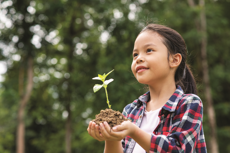 asian-girl-holding-plant-soil.png