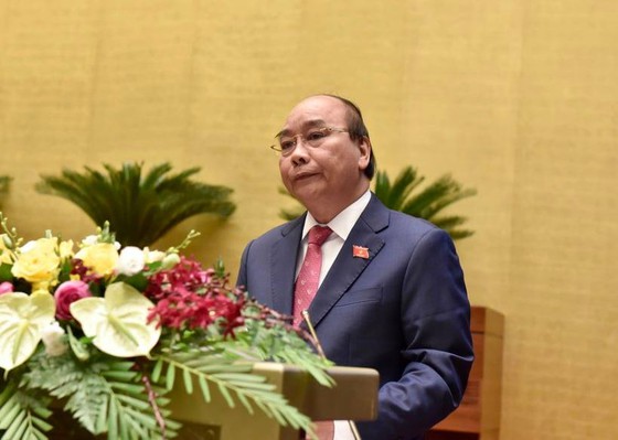 Thủ tướng Chính phủ Nguyễn Xuân Phúc đã trình bày báo cáo về tình hình kinh tế - xã hội. Ảnh: QUANG PHÚC.